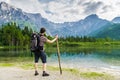 View on hiking tourist and lake near Alps in Almsee in Austria