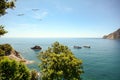 View from hiking trail to beautiful coastline and beach of mediterranean sea near village Monterosso al Mare in early summer,