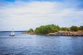 View from a hill over the Baltic Sea, washing the archipelago-bastion of Suomenlinna, Helsinki, Finland. Ice-covered cliffs, gray