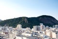 View of hill in Parque Estadual da Chacrinha, in copacabana, next to the many Copacabana rooftops. Taken from hotel rooftop