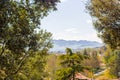 View of hills of Italian countryside framed by tree Royalty Free Stock Photo