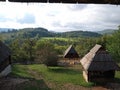 View of hills and wooden huts