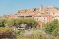 View of hilltop medieval ochre village of Roussillon, one of the most beautiful villages of France in a sunny summer day