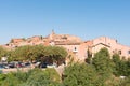 View of hilltop medieval ochre village of Roussillon, one of the most beautiful villages of France in a sunny summer day