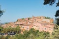 View of hilltop medieval ochre village of Roussillon, one of the most beautiful villages of France in a sunny summer day