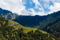 View of the himalayan peak covered with snow and small indian village in the forest