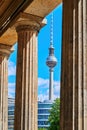 View through historic arcades on Museum Island in Berlin to the TV tower at Alexanderplatz