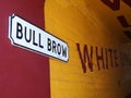 View of the historic bull brow passage in rochdale with painted victorian advertisements