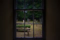 View of a historic cemetery through a blurry window in the subsection of Nigg in Tain Scotland