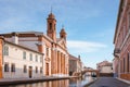 Ponte degli sbirri in Comacchio, Italy with Delta Antico museum Royalty Free Stock Photo