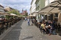 View of the historic center of Ljubljana and several tourists passing by