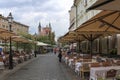 View of the historic center of Ljubljana and several tourists passing by