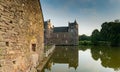 View of the historic Chateau Trecesson castle in the Broceliande Forest with reflections in the pond Royalty Free Stock Photo