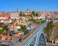 View of the historic city of Porto and Luis I Bridge with Metro train in the sunny day, Portugal