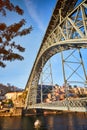 View of the historic city of Porto, Portugal with the Dom Luiz bridge. A metro train can be seen on the bridge Royalty Free Stock Photo