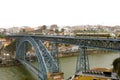 View of the historic city of Porto, Portugal with the Dom Luiz bridge. Two metro train can be seen on the bridge Royalty Free Stock Photo