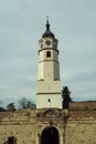View of the historic clock tower in Kalemegdan Park against a cloudy sky