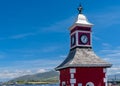 View of the historic clock tower and weigh station on the Royal Pier of Knight`s Town on Valentia Island in County Kerry