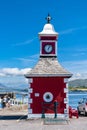 View of the historic clock tower and weigh station on the Royal Pier of Knight`s Town on Valentia Island in County Kerry