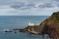 View of the historic Hartland Point lighthouse and headland on Bristol Bay Royalty Free Stock Photo