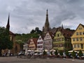 View of historic marketplace in the center of Esslingen with old buildings, the steeple of Frauenkirche and vineyards.