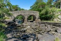 View of the historic Old Weir Bridge at The Meeting of The Waters in Killarney National Park Royalty Free Stock Photo