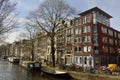 View of historic residential and commercial building on the corner of Bloemgracht and Eerste Bloemdwarsstraat in Amsterdam