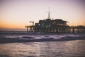 View of historic Santa Monica pier, with beach, amusement park, shops and restaurants, Los-Angeles, California, United States of Royalty Free Stock Photo