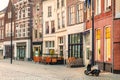 View at a historic square with bars, restaurants and shops in the ancient city center of the Dutch city of Zutphen