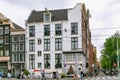 AMSTERDAM, NETHERLANDS - JUNE 25, 2017: View of the historical buildings on the Raadhuisstraat street.