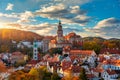 View of historical centre of Cesky Krumlov town on Vltava riverbank on autumn day overlooking medieval Castle, Czech Republic.