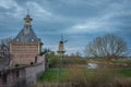 View of historical city gate known locally as Dalempoort and an old windmill in the city of Gorinchem, Province South Holland Royalty Free Stock Photo