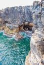 a hole in a rock called the mouth of hell or Boca do Inferno in Cascais in Portugal Royalty Free Stock Photo