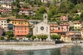 View on the Holy Trinity Church situated in Argegno village on the shore of Lake Como, Italy Royalty Free Stock Photo