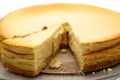 view in a homemade cheesecake with a sliced piece, unusual perspective with very narrow depth of field