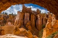 A view of hoodoos seen through a rock arch in Bryce Canyon, Utah