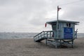 A view of horizon, seascape, ocean, sailing yachts and lifeguard in the beach in Venice, California in cloudy sky