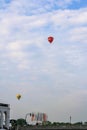 View of hot air balloon fly in high sky at Kleine Alster in summer with clouds in blue sky background