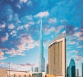 View of hotel Address Dubai Marina, Dubai mall and Burj Khalifa against dramatic sky. View of landmarks of residential