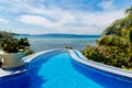 View from a hotel with infinity pool on the tropical beach and beautiful sea with boats on Boracay island, Philippines Royalty Free Stock Photo