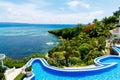 View from the hotel with infinity pool on the tropical beach and beautiful sea with boats on Boracay island, Philippines. Blue sky Royalty Free Stock Photo