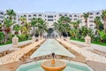 View of the hotel, Kantaoui Bay Iberostar Selection. Fountain in front of the hotel and the inscription Kantaoui Bay - Mideast, Royalty Free Stock Photo
