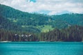 view of hotel near lake in dolomites mountains in italy Royalty Free Stock Photo