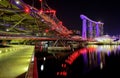 View of the hotel ÃÂ«Marina Bay SandsÃÂ», Helix Bridge and in the evening in Singapore. Royalty Free Stock Photo