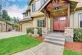 View of house entrance with stone column trim and double doors Royalty Free Stock Photo