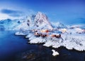 View on the house in the Hamnoy village, Lofoten Islands, Norway. Landscape in winter time during blue hour. Mountains and water. Royalty Free Stock Photo