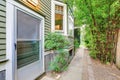 View of house side wall with walkway to the backyard Royalty Free Stock Photo