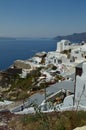 View Of Houses With Blue Vaulted Rooftop With View Of Bluish Aegean Sea In Oia Town Santorini Island. Architecture, Landscapes, Tr Royalty Free Stock Photo