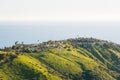 View of houses, green hills, and the Pacific Ocean from Top of the World, in Laguna Beach, California Royalty Free Stock Photo