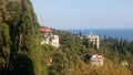 View of houses,sea and autumn trees